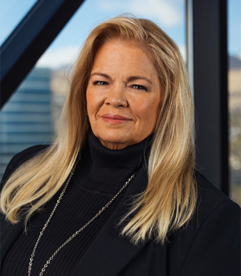 Heidi Walker COO of Utah Chamber headshot. Heidi is wearing a black turtle neck with blond hair.